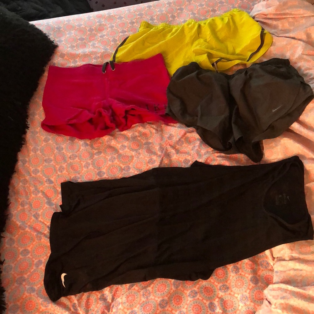 2 shorts and a tank top athletic